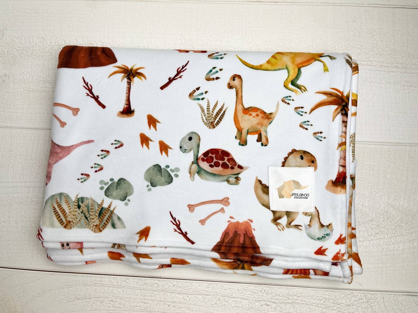 Couverture magiks - Dinos et oeufs rose pour toddler (Erreur d'impression)