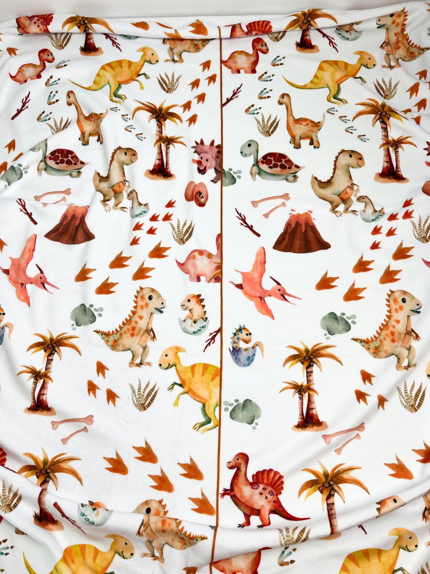 Couverture magiks - Dinos et oeufs rose pour toddler (Erreur d'impression)